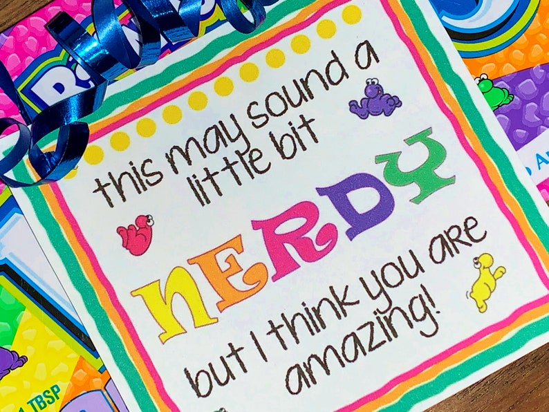 May include: A colorful card with the text "this may sound a little bit NERDY but I think you are amazing!" with a rainbow border and cartoon animals.