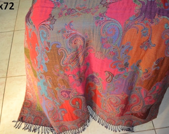 May include: A colorful paisley patterned shawl with a fringe border. The shawl is made of a soft, luxurious fabric and features a variety of colors, including pink, purple, blue, and orange.