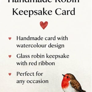 May include: A white card featuring the text Handmade Robin Keepsake Card, a red heart icon, and a list of features including a handmade card with watercolour design, a glass robin keepsake with red ribbon, and a watercolour illustration of a robin.