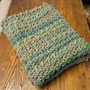 Hand crocheted boho cobble afghan predominantly green with color variations