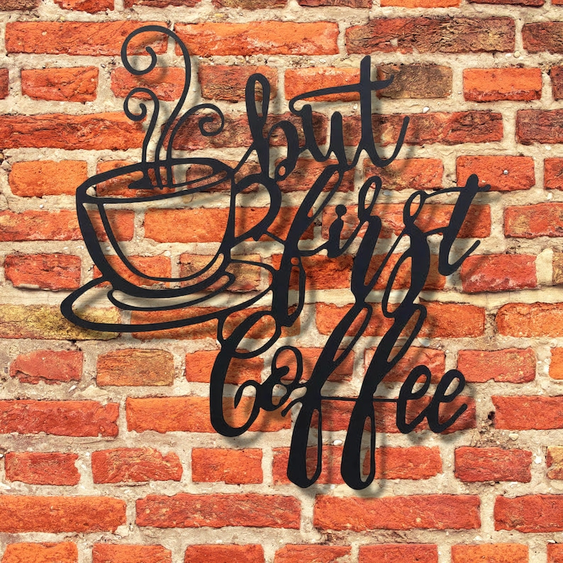 May include: Black metal wall art with a coffee cup and the text "But first, coffee".