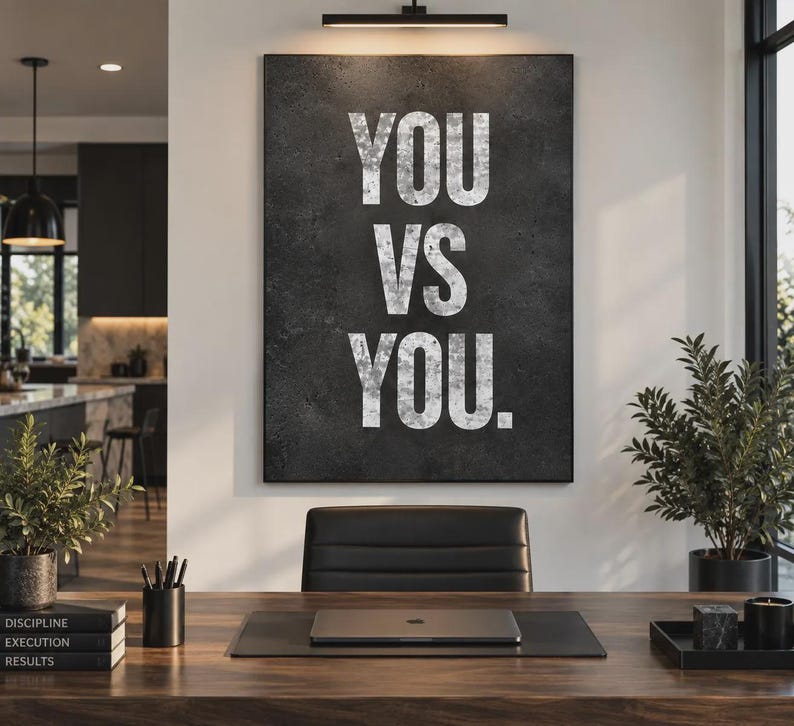 May include: A rectangular wall art piece featuring a dark gray, textured background with the white, distressed-style text "YOU VS YOU." centered in large, bold, sans-serif capital letters. The artwork is displayed in a vertical orientation.