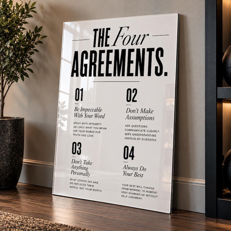 May include: A rectangular white wall art print featuring the black text The Four Agreements. It lists four numbered principles: Be Impeccable With Your Word, Don't Make Assumptions, Don't Take Anything Personally, and Always Do Your Best.
