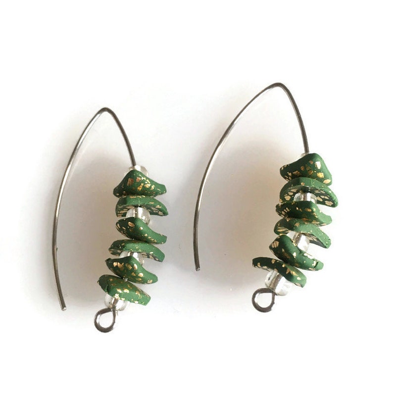 Trend hoops. Feminine creative jewelry Handmade earrings in fashion design