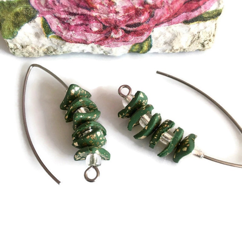 Trend hoops. Feminine creative jewelry Handmade earrings in fashion design
