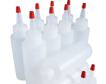 May include: A set of ten clear plastic squeeze bottles with red caps. The bottles are all the same size and shape, and they are arranged in a group.