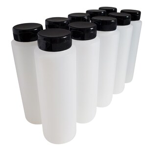 May include: Ten clear plastic bottles with black screw-on lids. The bottles are lined up in a row, with the lids facing the viewer.
