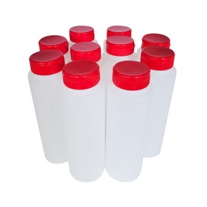 May include: Ten clear plastic bottles with red screw-on lids. The bottles are all the same size and shape.