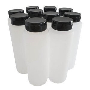 May include: Ten clear plastic bottles with black screw-on lids. The bottles are arranged in a semi-circle.