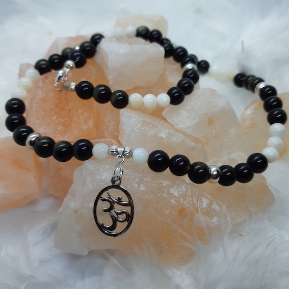 Necklace with obsidian beads, mother of pearl and OM symbol