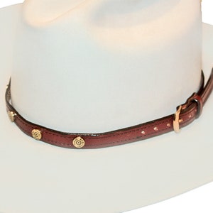 Hat Band Custom Handmade 5/8x 28 in long with gold type buckles and 38 or 45 shell heads