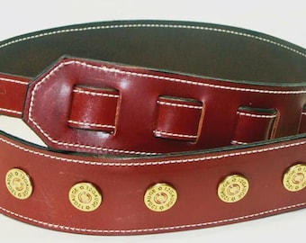 Correa de guitarra. Brida inglesa de cuero y 6 cápsulas calibre 12.