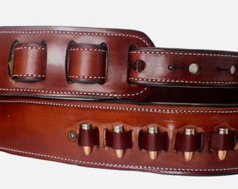 Custom handmade leather guitar strap featuring bullet conchos and fully lined