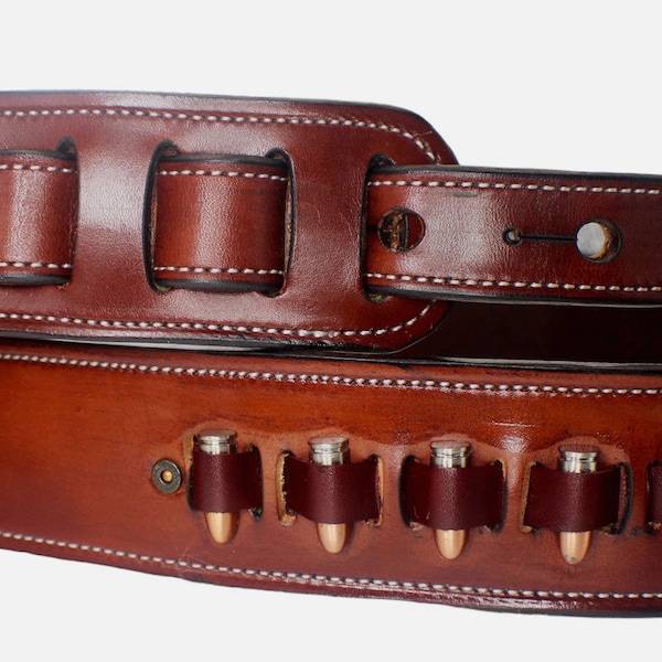 Custom handmade leather guitar strap featuring bullet conchos and fully lined