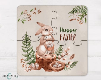 May include: A brown bunny rabbit holding a basket of Easter eggs sits on a tree stump surrounded by green ferns and white flowers. The background is a light brown with the text "Happy Easter" in green and red letters.