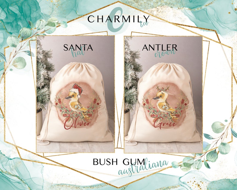 May include: Two personalized Christmas gift bags with drawstring closures. The bags are made of natural canvas fabric and feature a watercolor illustration of a kookaburra bird with a Santa hat and an antler crown. The bags are labeled "Oliver" and "Grace" with the text "Santa hat" and "Antler crown" above the illustrations. The text "Bush Gum australiana" is printed below the bags.