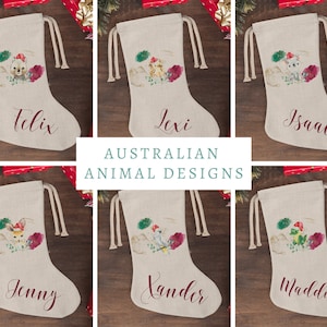 May include: Six personalized Christmas stockings with Australian animal designs. The stockings are beige with red and green accents. The names Felix, Lexi, Isaac, Jenny, Xander, and Maddison are embroidered on the stockings.