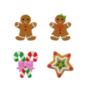 May include: Four embroidered Christmas designs on a white background. Includes a gingerbread man and woman, a candy cane with a pink bow, and a star-shaped cookie with green and pink accents. Ideal for festive crafts.
