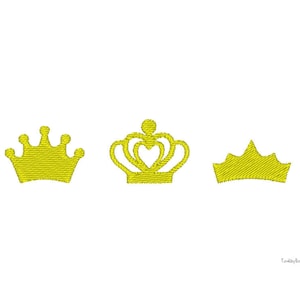 May include: Three yellow embroidered crown designs on a white background. The crowns vary in style, with one featuring a heart-shaped center. The embroidery has a textured appearance, suggesting a fabric or thread-based craft. The image is simple and elegant.