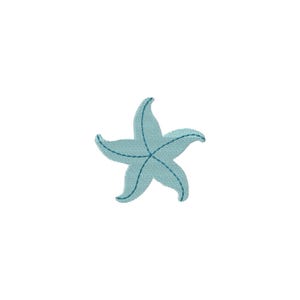 May include: A light blue starfish with five points, set against a white background. The starfish has a textured appearance with darker blue stitching details outlining each point and across the center, suggesting an embroidered design.