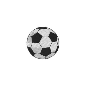May include: A circular embroidered patch featuring a classic soccer ball design. The pattern consists of alternating black and white pentagonal and hexagonal shapes stitched with visible thread texture, creating a detailed sports motif.