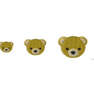 Może przedstawiać: Trzy haftowane naszywki z głowami misiów o różnych rozmiarach. Misie mają złotożółte futro, kremowe uszy oraz czarne nosy i oczy. Na białym tle.