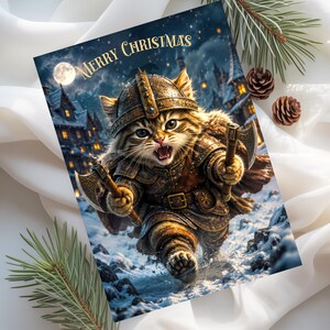 May include: A rectangular greeting card featuring a tabby cat dressed in detailed metal armor and a horned helmet, holding two small axes. The cat is running through a snowy village at night under a full moon. The text Merry Christmas is printed at the top.