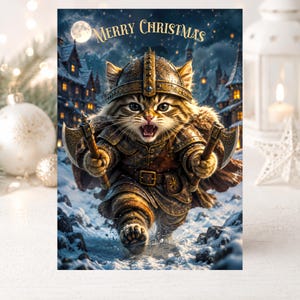May include: A greeting card featuring a tabby cat dressed as a warrior in ornate bronze armor and a helmet, holding two small axes. The cat is running through a snowy village at night under a full moon. The text Merry Christmas is at the top.