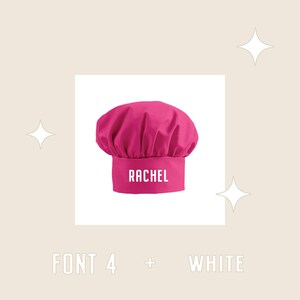 May include: Pink chef hat with the name Rachel in white text on the front. The hat is on a white background.