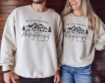 Custom Honeymoonin' Sweatshirts For Men And Women, Custom Location Mountain Honeymoon Wedding Gifts, Newlywed Sweaters For Couples