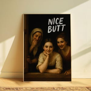 May include: Framed art print featuring a classical painting of three women, with the text "NICE BUTT" in white. The women are in a window, with one resting her chin on her hand.
