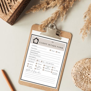 May include: A clipboard with a client intake form. The form has sections for full name, time frame, and mailing address. The form also includes checkboxes for buyer, seller, and lead source options like website and referral. The form is in black and white.