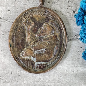 Rare antique religious medal of Saint Francis of Assisi and the Virgin Mary in brass