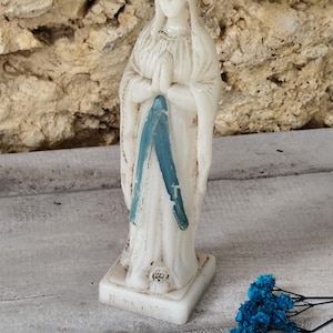 Antique religious statue of the Virgin Mary made of plastic