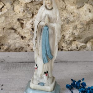 Antique religious statue of the Virgin Mary made of plastic
