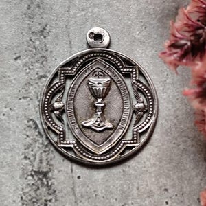 rare silver communion medal