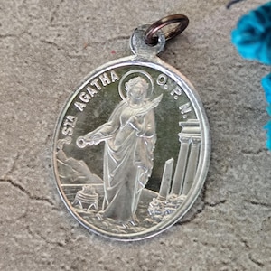 Antique religious medal of Saint Agatha and Saint Lucy