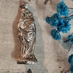 antique small religious statue of the virgin mary in metal