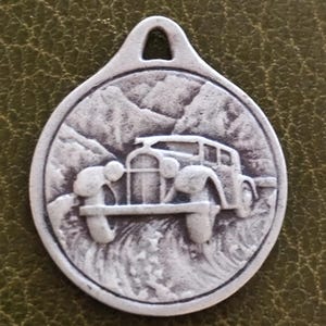 Silver saint Christopher medal