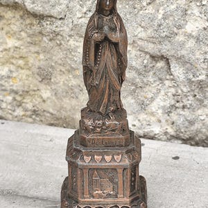 Small statue of the Virgin Mary, Our Lady of Lourdes statuette, antique religious object in metal