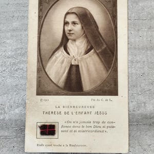 Carte relique de sainte Thérèse de Lisieux avec etoffe ayant touché à la bienheureuse