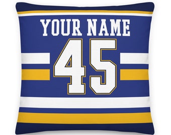 May include: Blue and gold throw pillow with white stripes and the text "YOUR NAME" and the number "45" in white.