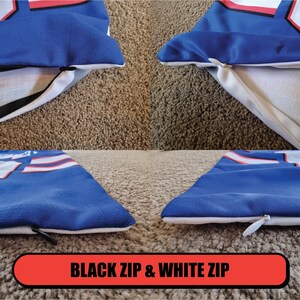 May include: Two pillowcases with a blue and white design. One pillowcase has a black zipper and the other has a white zipper. The pillowcases are on a brown carpet.