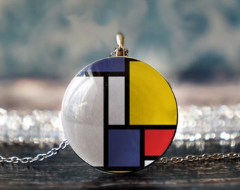May include: A silver chain necklace with a round pendant featuring a geometric design in white, blue, yellow, and red.
