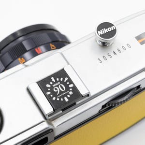 Nikon 100周年　ホットシューカバー ニコン Nikon 100周年記念 アクセサリーシューカバー(新品) : 観