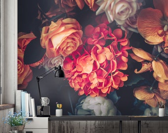 May include: A floral wallpaper mural featuring a close-up of a bouquet of orange, pink, and white flowers. The flowers are arranged in a cluster and have a vintage, romantic feel.