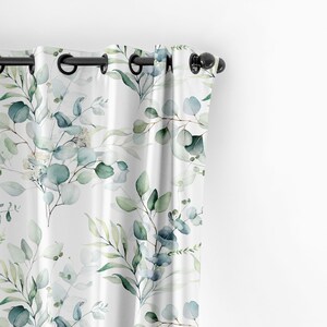 May include: White curtains with a watercolor pattern of green and blue eucalyptus leaves.
