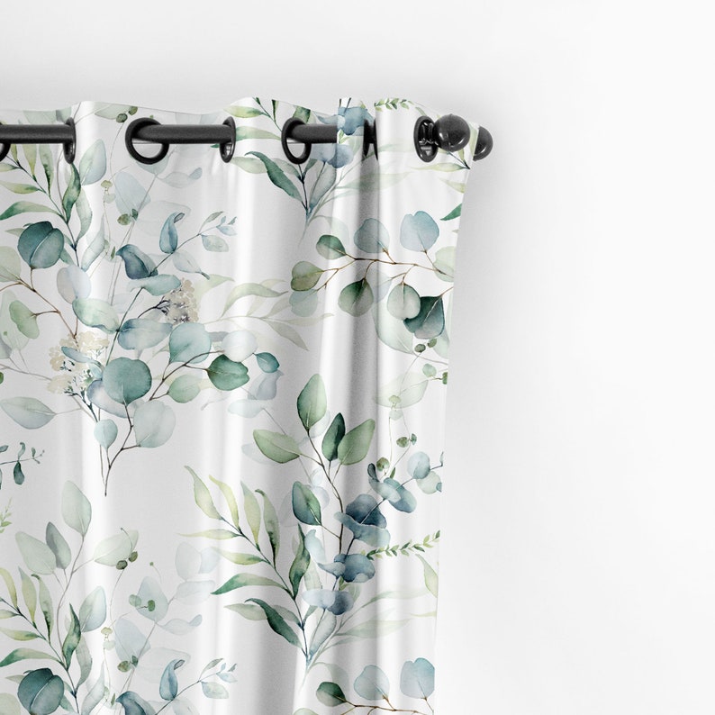 May include: White curtains with a watercolor pattern of green and blue eucalyptus leaves.