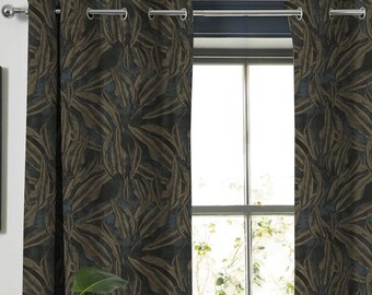 May include: A pair of dark brown and teal patterned curtains with silver grommets hanging on a silver curtain rod.