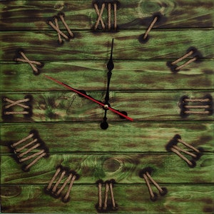 May include: A rustic wooden clock with Roman numeral hour markers and rope accents. The clock face is green with a black and red hour and minute hand.